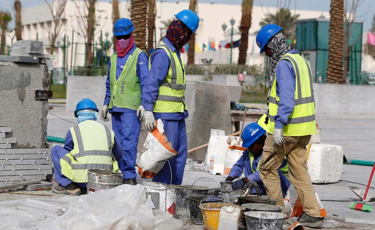Migrant workers are treated in Qatar according to their racial identity