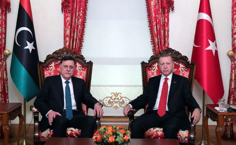Turkish President Recep Tayyip Erdogan (R) and GNA head Fayez al-Sarraj (L)