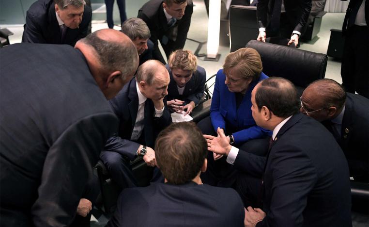 Russia's President Vladimir Putin and German Chancellor Angela Merkel meet on sideline of the Libya summit in Berlin