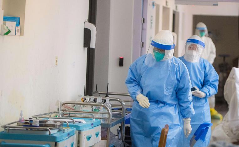 Medical personnel wearing protective suits work in the department of infectious diseases at Wuhan Union Hospital in Wuhan