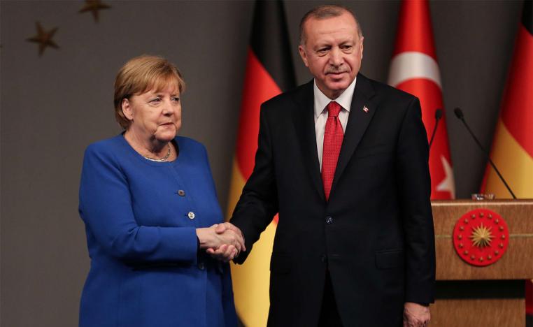 Turkish President Recep Tayyip Erdogan and German Chancellor Angela Merkel shake hands after a mutual press conference