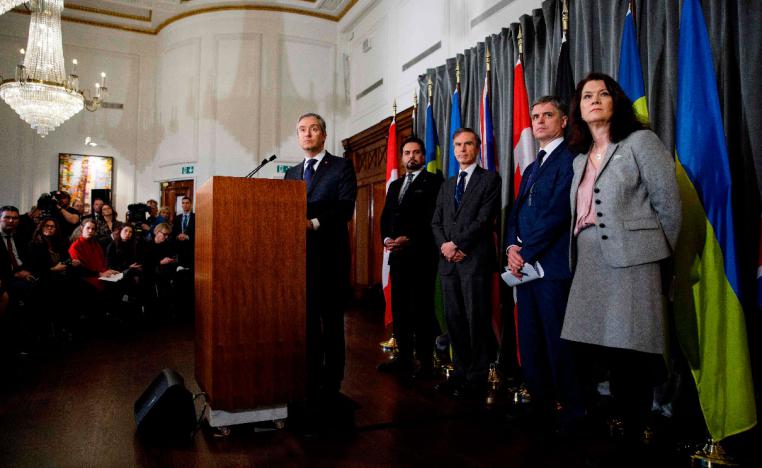 Canadian Minister of Foreign Affairs Francois-Philippe Champagne (C) addresses a press conference