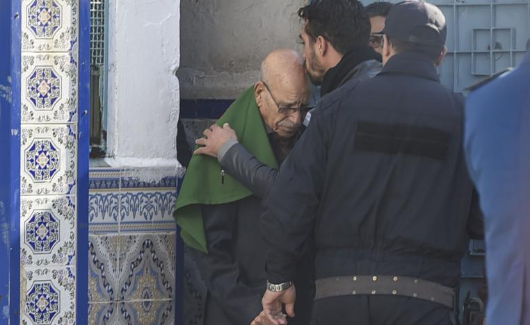 A relative kisses the head of Algerian war veteran Lakhdar Bouregaa upon his release in Algiers