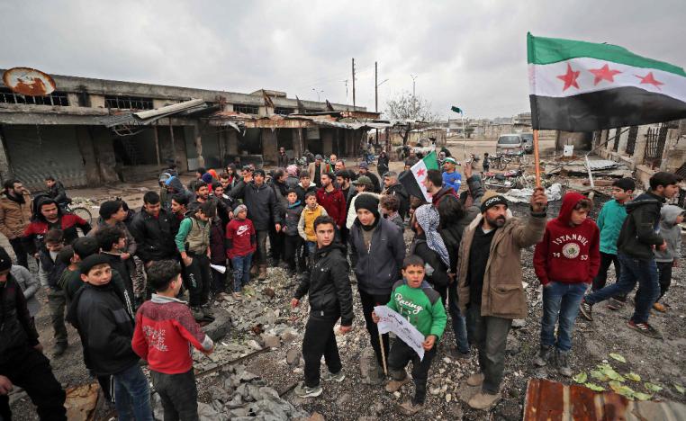 Syrians take part in a demonstration against the regime offensive in Syria's last major opposition bastion of Idlib
