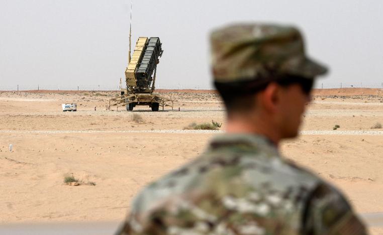 A member of the US Air Force stands near a Patriot missile battery at the Prince Sultan air base in al-Kharj, central Saudi Arabia