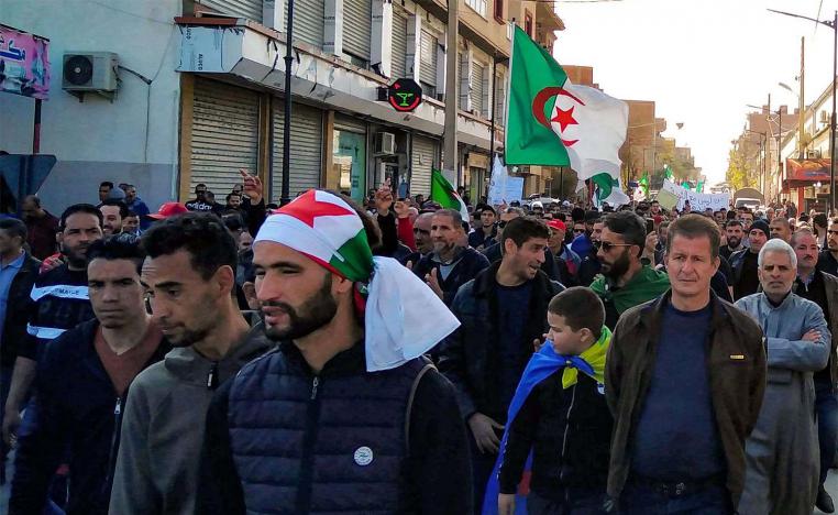 Algerians march in an anti-government demonstration in the Algerian city of Bordj Bou Arreridj on Feb. 14