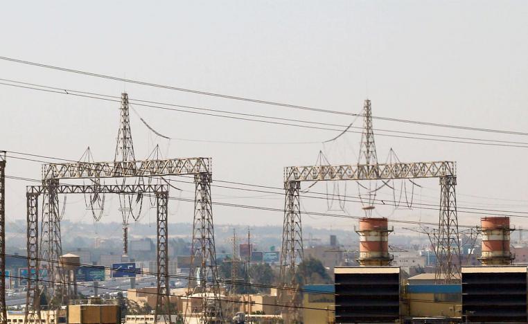 Electricity pylons and power transmission lines are seen in Cairo