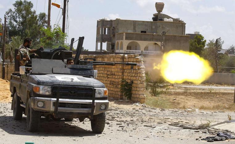 Fighter loyal to GNA fires a truck-mounted gun