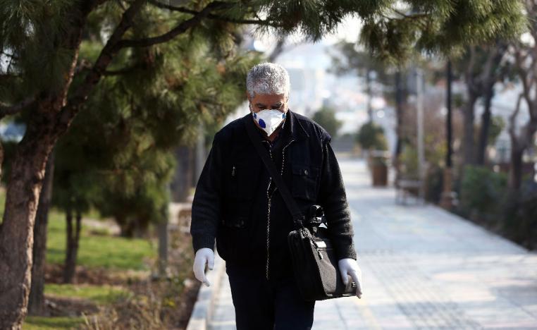 An Iranian man wears a protective mask to prevent contracting coronavirus
