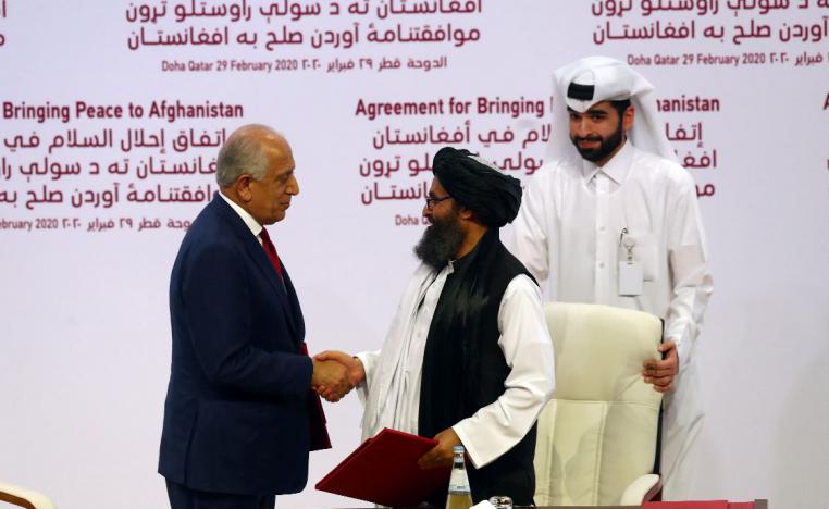 Zalmay Khalilzad, US envoy for peace in Afghanistan and Mullah Abdul Ghani Baradar, the leader of the Taliban delegation