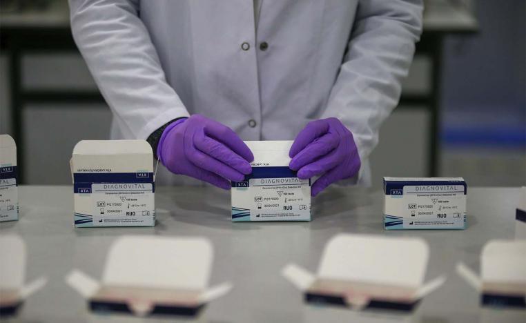A research and development company worker works on the production of coronavirus testing kits in Gebze, northwestern Turkey
