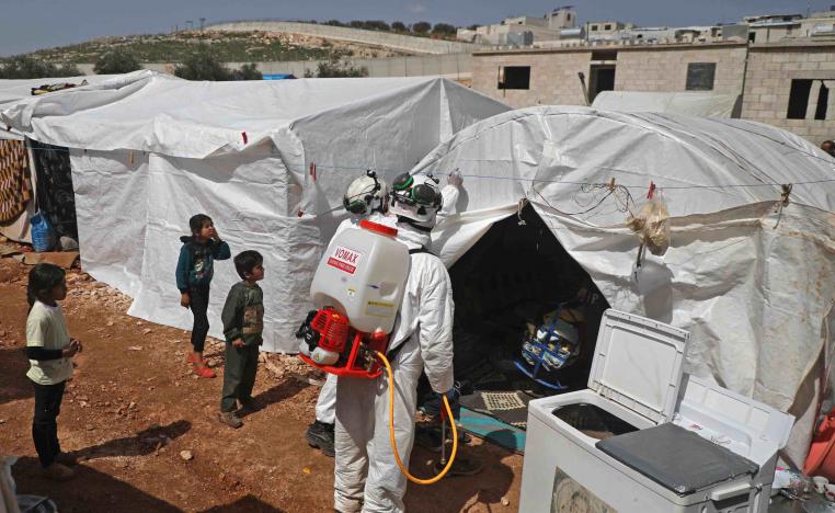 As part of the effort to prevent the worst in the rebel-held Idlib region, a doctor is visiting Yassin's camp in Kafr Lusin to raise awareness