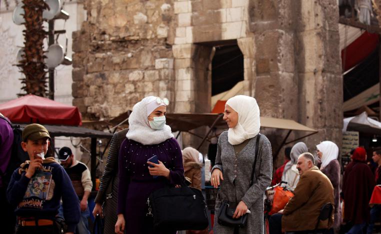 A woman wears a face mask as a preventive measure against the coronavirus, in old Damascus, Syria