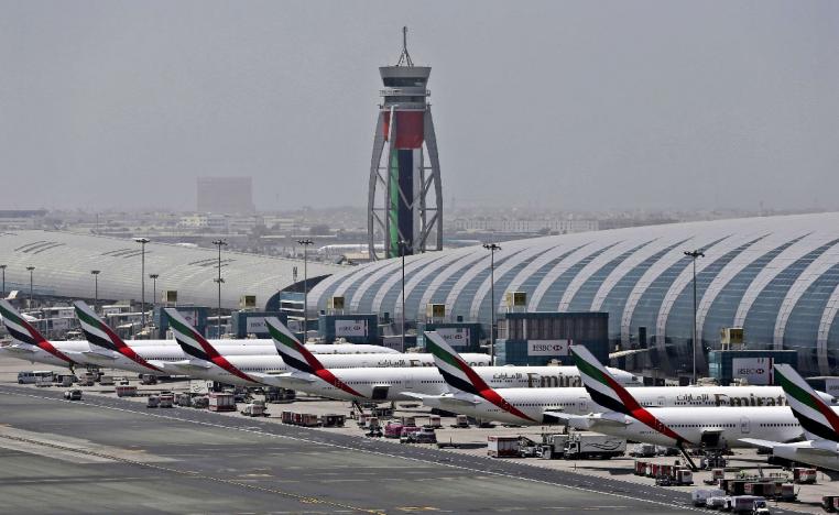 Emirates planes are parked at the Dubai International Airport in Dubai