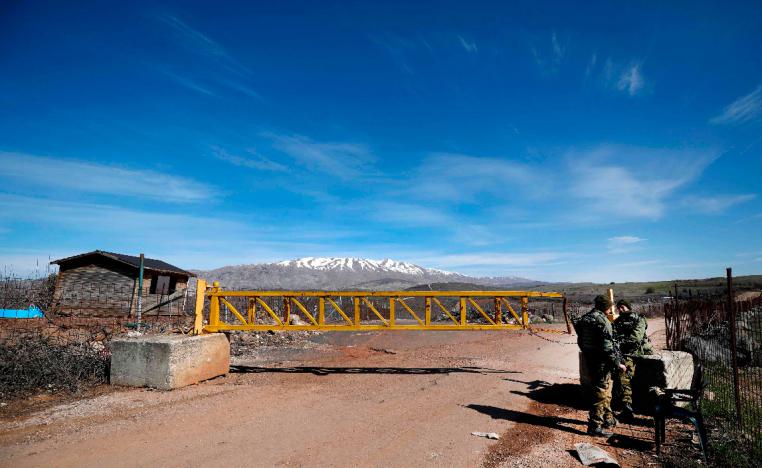 Israeli forces block a road leading to the Syrian border in the Israeli-occupied Golan Heights