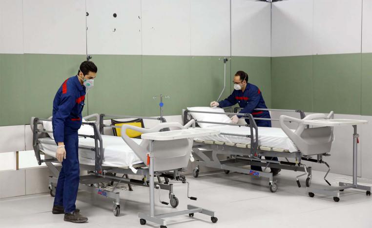 Iranian workers set up a makeshift hospital inside the Iran Mall, northwest of Tehran