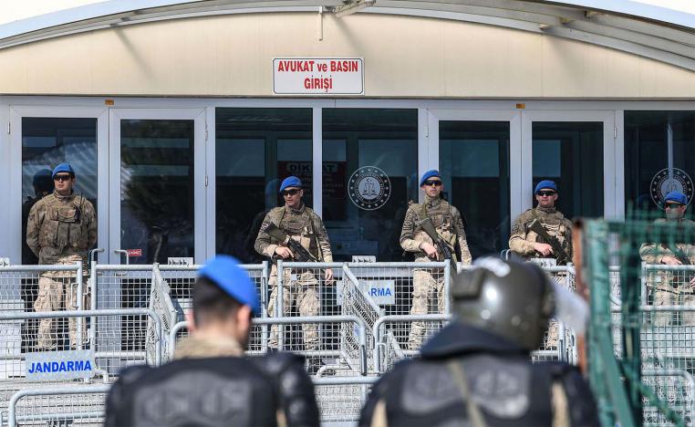A member of the media waits in front of the Silivri Prison and Courthouse complex in Silivri, near Istanbul