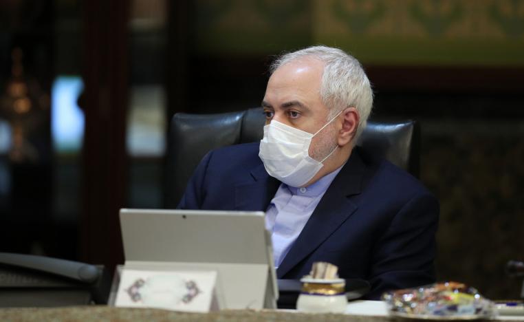 Iranian Foreign Minister Mohmmad Javad Zarif wearing a protective mask