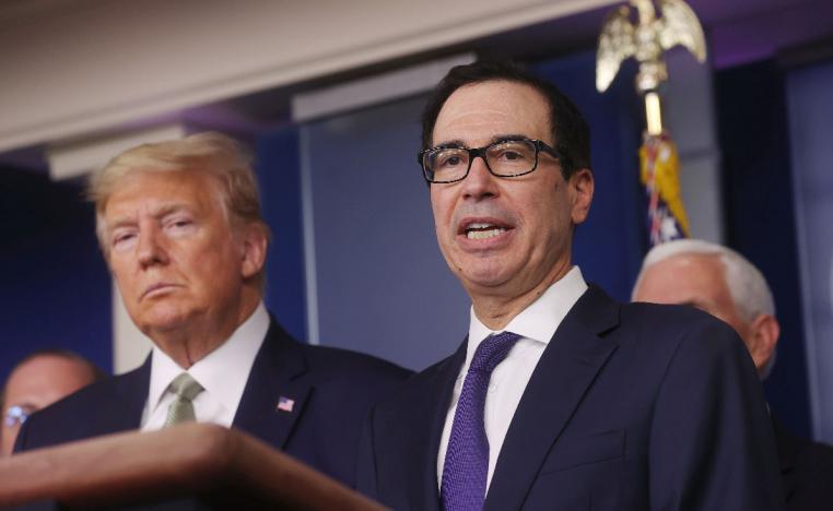 US President Donald Trump and Treasury Secretary Steven Mnuchin attend a press briefing at the White House