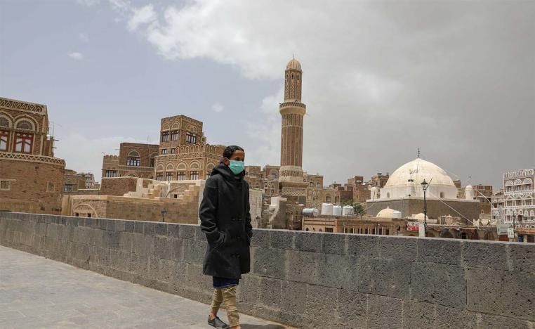 A girl wears a protective face mask amid fears of the spread of the coronavirus disease (COVID-19) in Sanaa