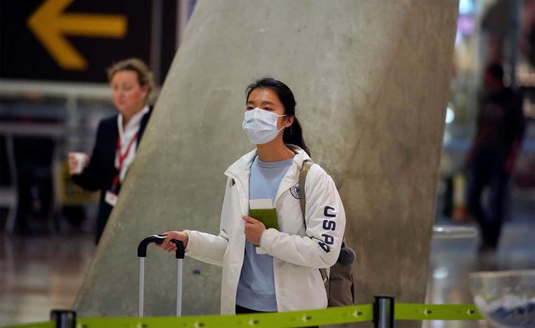  passenger, wearing a protective mask at Madrid's Adolfo Suarez Barajas Airport