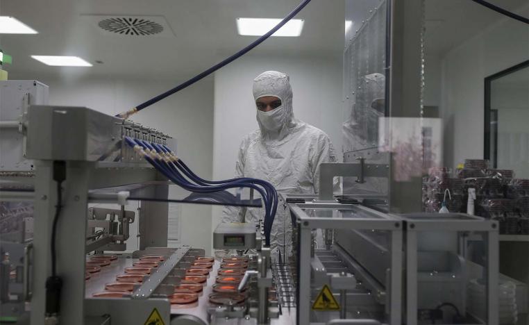 A worker oversees the production of coronavirus testing kits in Gebze, northwestern Turkey,