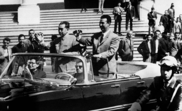 On March 31, 1965, Algerian President Ahmed Ben Bella (R) and Chinese Prime minister Chou En Lai wave to the crowd in Algiers