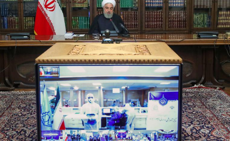 Iranian President Hassan Rouhani attends a video conference