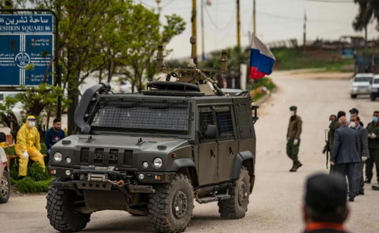 A Russian military vehicle drives in the vicinity of Qamishli airport, Syria