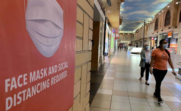People, wearing protective masks to prevent the spread of the coronavirus, walk in Ibn Battuta mall in Dubai