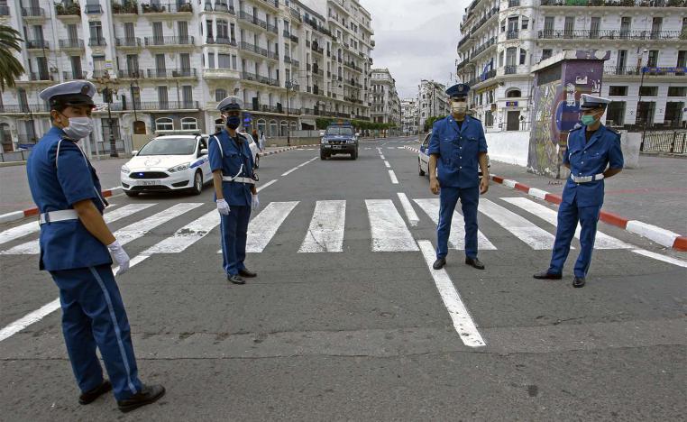 Algerian police officers block the access in downtown Algiers