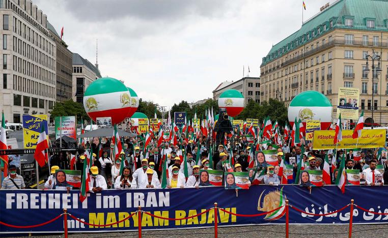 Supporters of Iranian opposition leader Maryam Rajavi and the National Council of Resistance of Iran (NCRI) gather to protest against the death penalty in Iran
