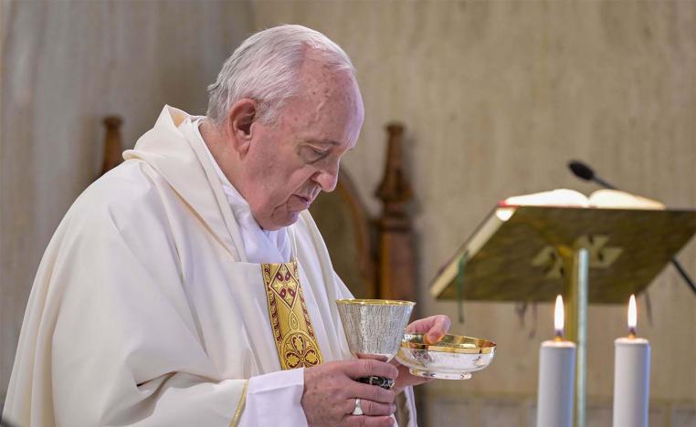 Pope Francis celebrating the Eucharist during a mass at the Santa Marta chapel in The Vatican