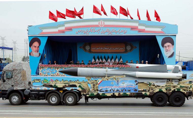 A Iranian military truck carrying a missile drives in front of the officials' stand during a military parade marking the annual National Army Day in Tehran last year