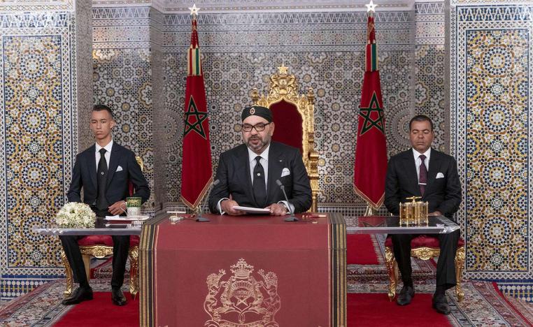 Morocco's King Mohammed VI, center, accompanied by his son Crown Prince Moulay Hassan, left, and brother Prince Moulay Rachid