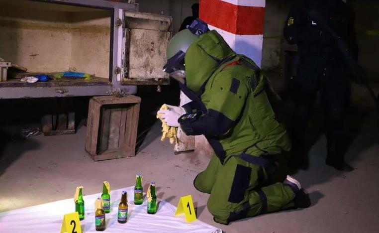 Explosives technician handling the seized substances