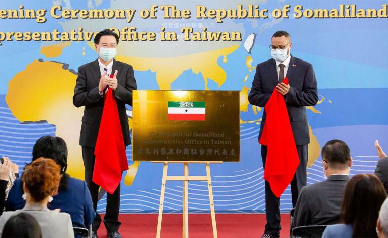 Taiwan's Foreign Minister Joseph Wu and Somaliland representative to Taiwan, Mohamed Hagi unveil the Somaliland office plate during an opening ceremony in Taipei