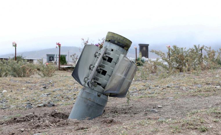 he remains of a rocket shell are seen near a graveyard in the town of Ivanyan (Khojaly) in the breakaway region of Nagorno-Karabakh