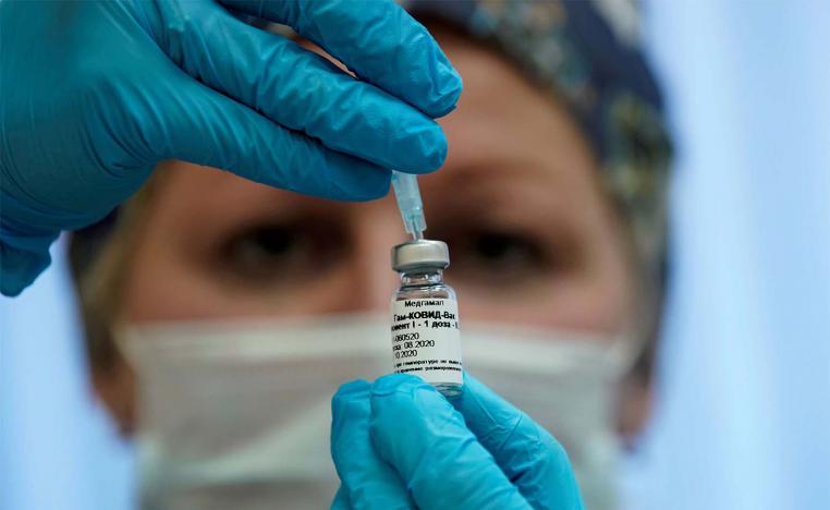 A nurse prepares Russia's "Sputnik-V" vaccine against the coronavirus disease