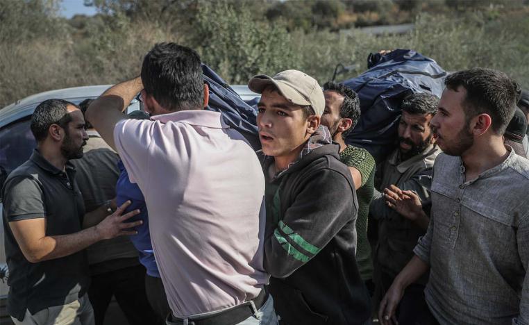 Syrians carry the coffin of one of the fighters of the Turkish-backed Faylaq al-Sham rebels grou