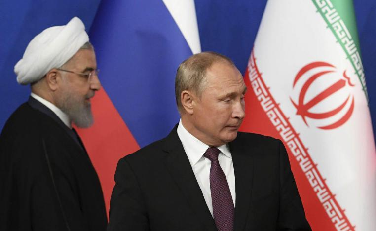 الرئيس الروسي فلاديمير بوتين ونظيره الايراني حسن روحاني