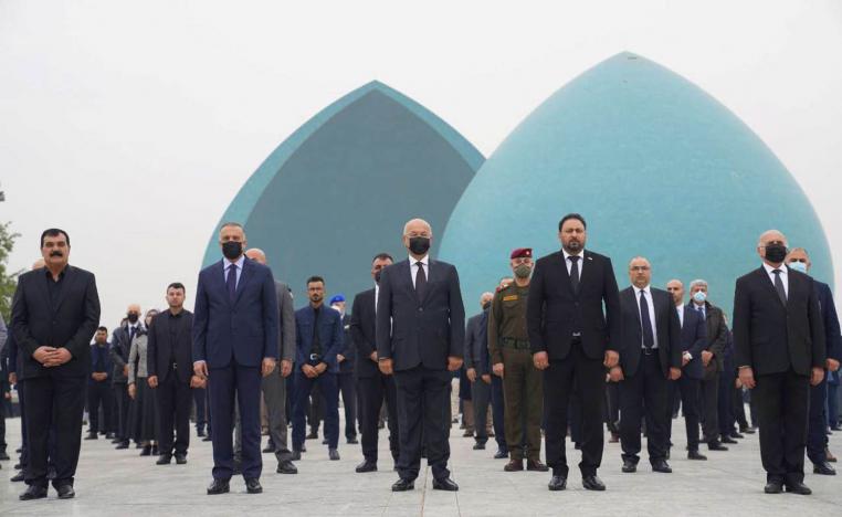 الرئيس العراقي برهم صالح ورئيس الوزراء مصطفى الكاظمي خلال حفل تأبين في بغداد لشهداء يزيديين قتلهم داعش
