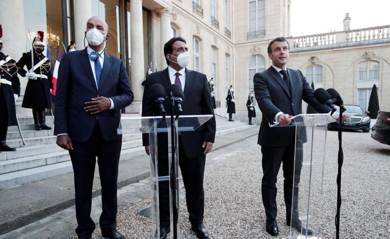  الرئيس الفرنسي إيمانويل ماكرون ورئيس المجلس الرئاسي الليبي محمد المنفي