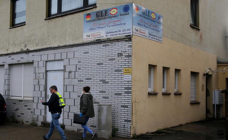 German special police walks in front of the premises of the Gemeinschaft libanesischer Emigranten e.V. (community of Lebanese emigrants) in Dortmund