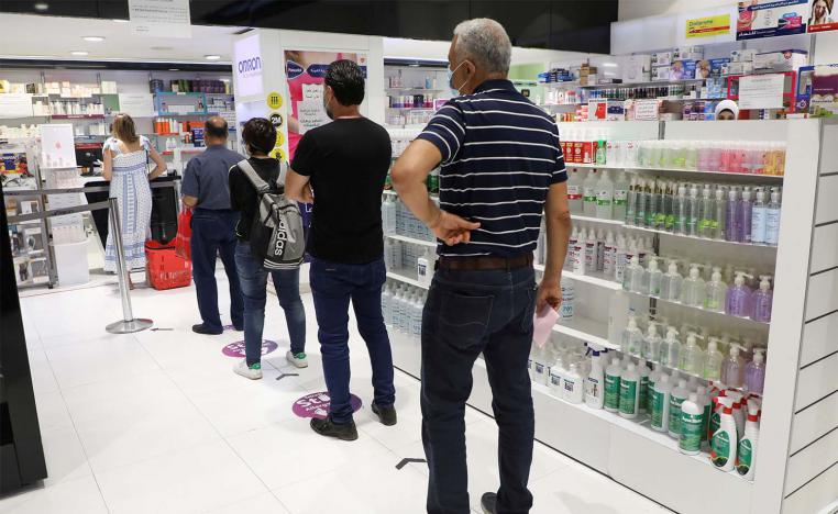 Lebanese queue up in a pharmacy