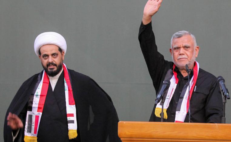 زعيما ميليشيات بدر وعصائب الحق هادي العامري وقيس الخزعلي في تجمع انتخابي في بغداد
