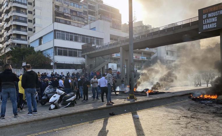 Roads were blocked by burning tyres in central Beirut, Tripoli and Sidon
