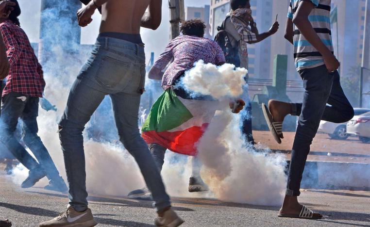 Braving tear gas to protest against military rule
