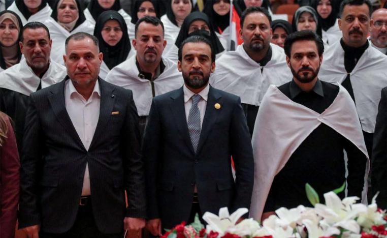 Iraq's newly elected for a second term as speaker of Parliament Mohammed al-Halbousi (C)