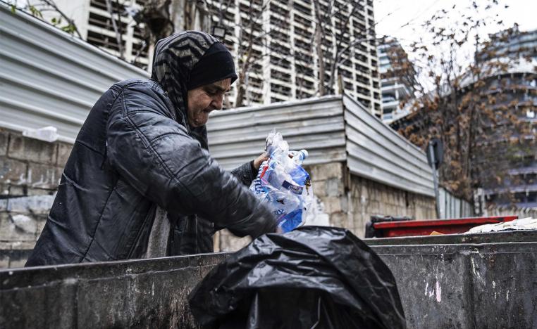 Scavenging through trash to survive